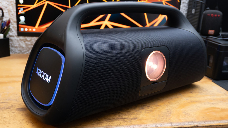 A Bluetooth speaker on a wooden table
