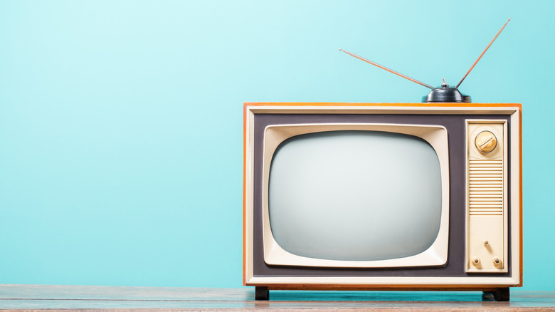 An old TV with an antenna on the top