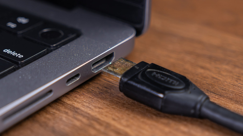 HDMI cable aboud to be plugged into a laptop