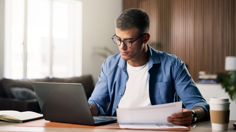 Professional using laptop at desk