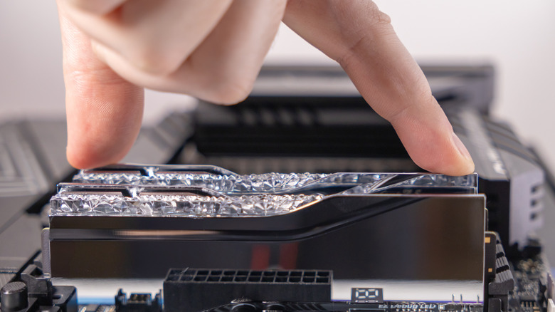 RAM sticks being installed on motherboard