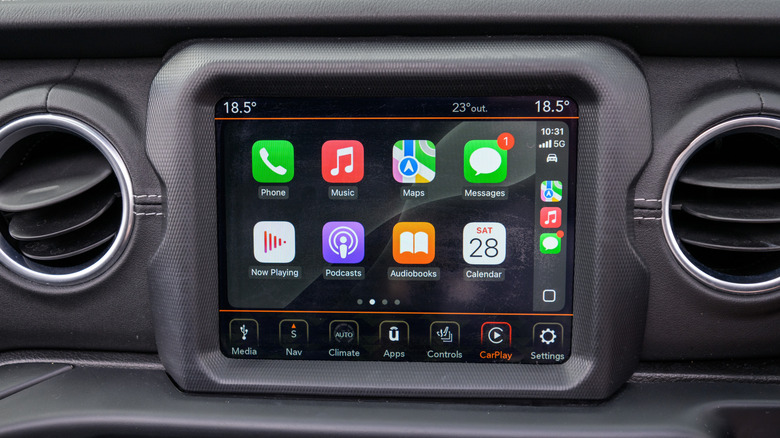 An infotainment system displaying the Apple CarPlay Home screen
