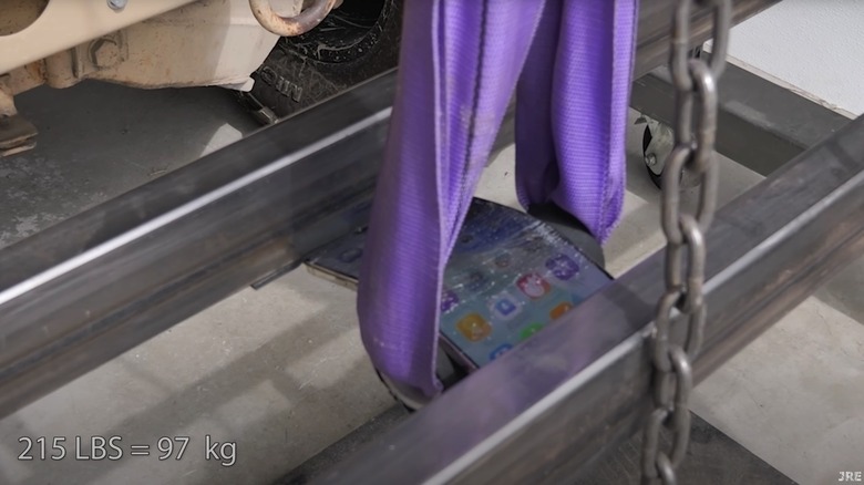 Using tools to bend the iPhone Air.