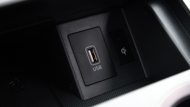 A close-up of a USB-A port in a vehicle.