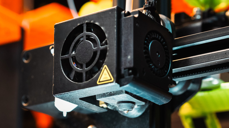 Close up of a 3D printer extruder
