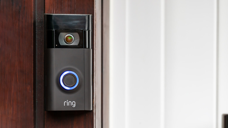 a Ring doorbell camera with a blue light