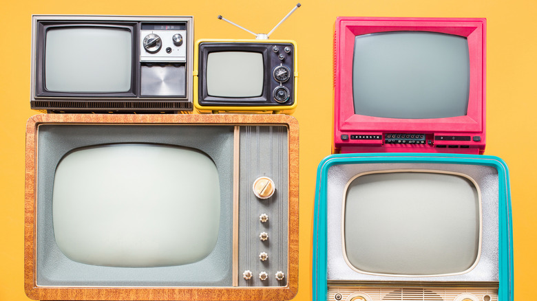 Retro TV sets on a yellow background