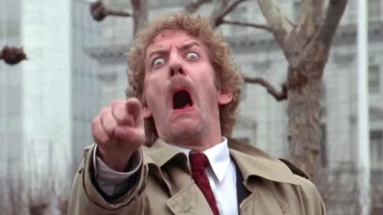 Matthew (Donald Sutherland) pointing in 