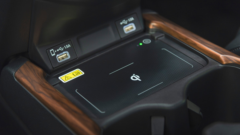 Center console USB and device storage with voltage clearly labeled.