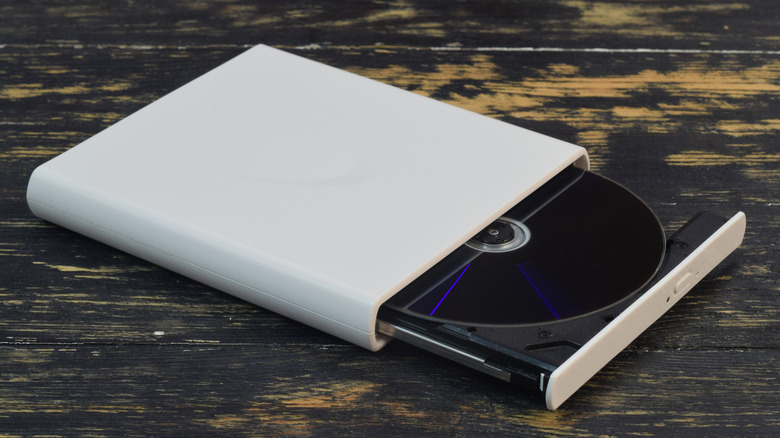 A portable optical disk drive placed on a table
