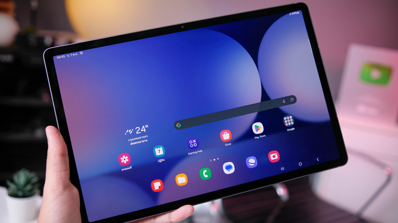 Someone holding an Android tablet