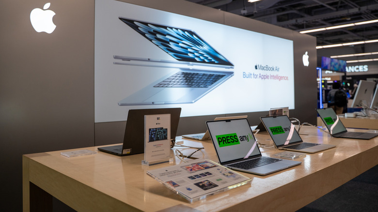 MacBooks on display at a store
