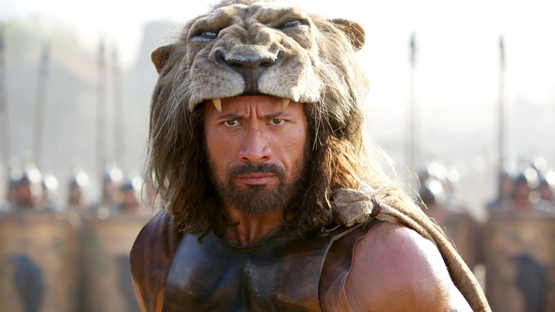 Hercules (Dwayne Johnson) wearing lion head gear