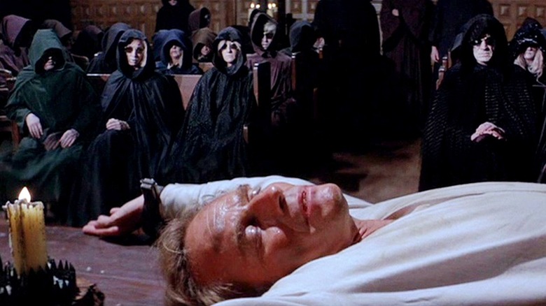 Robert Neville (Charlton Heston) tied up on an altar, surrounded by cultists, in "The Omega Man."