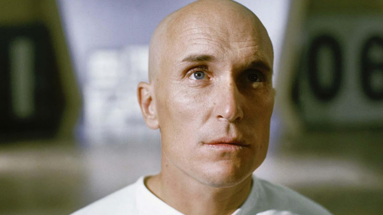 THX (Robert Duvall) looking up at something in "THX 1138."