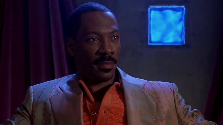 Pluto Nash (Eddie Murphy) wearing a suit