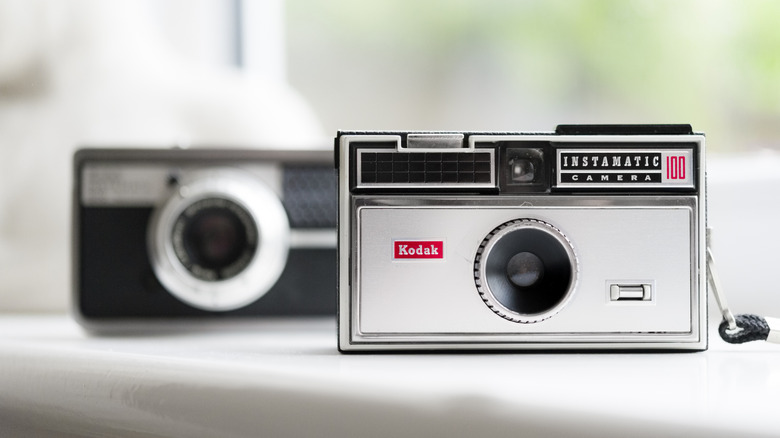 A Kodak Instamatic 100 camera on a windowsill