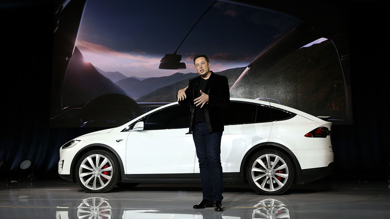 Elon Musk speaking at a Tesla EV launch event