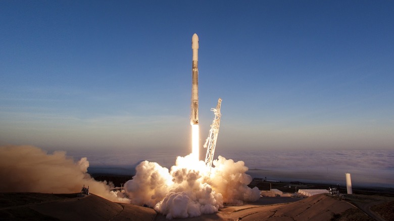 A SpaceX Falcon 9 rocket launching to space.