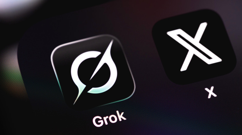 xAI and Grok logo on smartphone with Elon Musk photo in background.