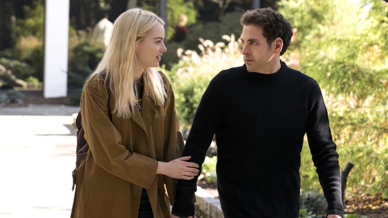 Annie Landsberg (Emma Stone) taking the arm of Owen Milgrim (Jonah Hill) in Maniac