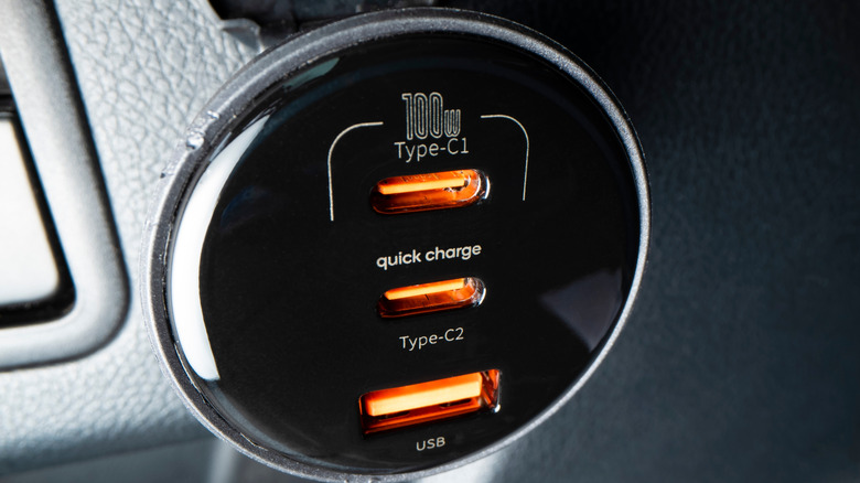 The front of a multi-port USB car charger with two Type-C ports and one USB-A port