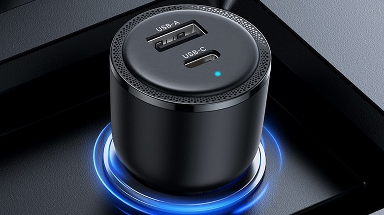 Ugreen 63W USB-C Car Charger plugged into a car's 12V socket