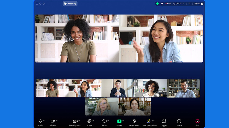 Zoom video calling app showing multiple speakers and video recording options.