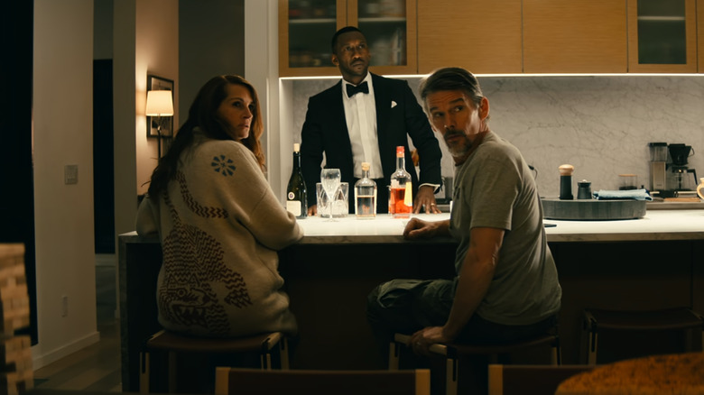 Leave the World Behind Sanfords and G.H. in kitchen at night