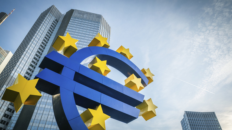 Large blue Euro currency sign.