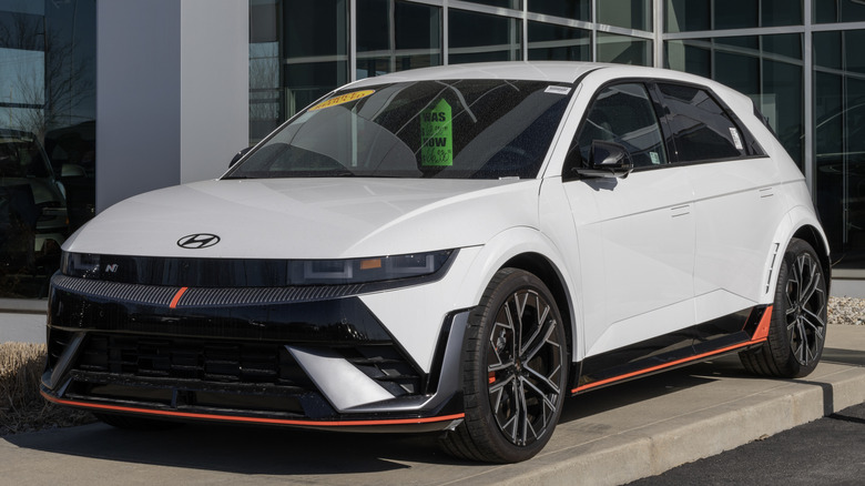 White Hyundai Ioniq 5 N parked outside a dealership.