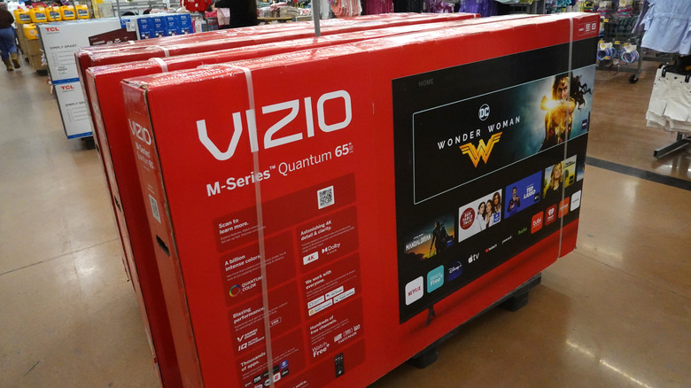 A stack of Vizio TVs at a retail outlet.