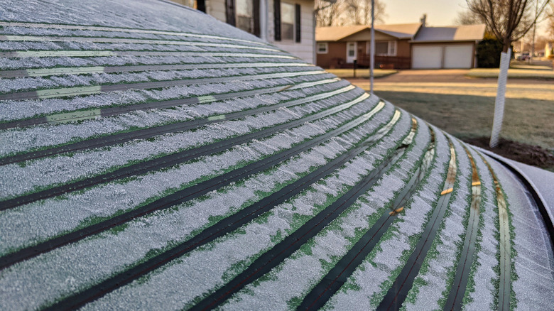 Rear defroster lines on a car working to remove frost and condensation.