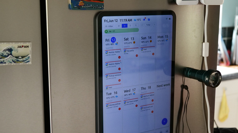 Everblog FridgeCal magnetically attached to fridge in portrait mode and displaying a calendar