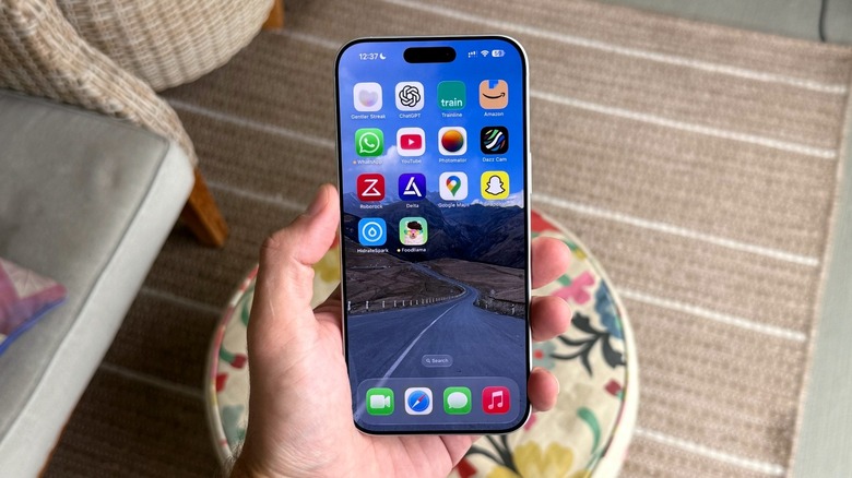 A hand holding an iPhone