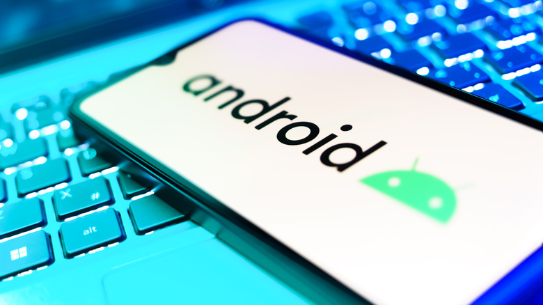 Smartphone on surface showing Android logo