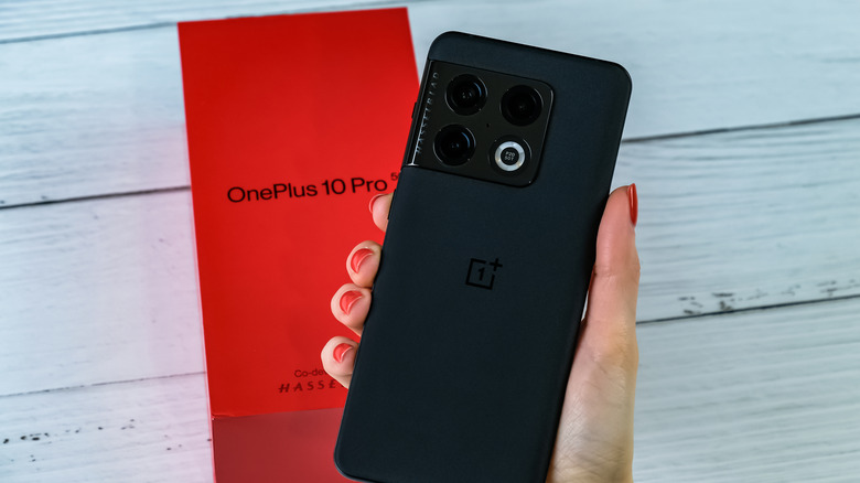 Person holding black OnePlus smartphone