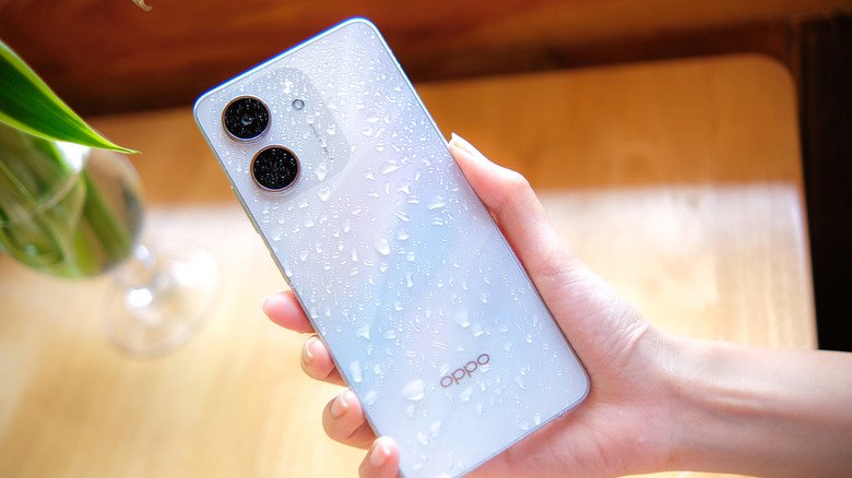 Person holding Oppo A5x smartphone