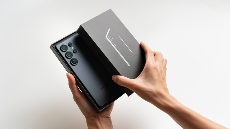 Person unboxing Samsung Galaxy S25 Ultra