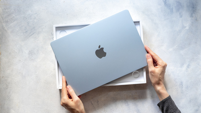 The M4 MacBook Air laptop during an unboxing process.