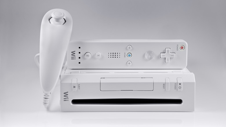 The Nintendo Wii console, the Wiimote, and the Nunchuck on a white background