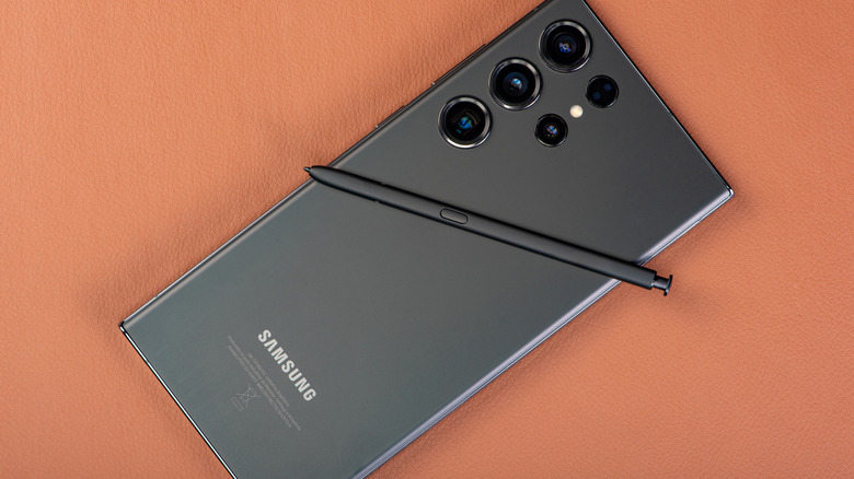 Samsung S23 Ultra phone with S Pen placed on top of it