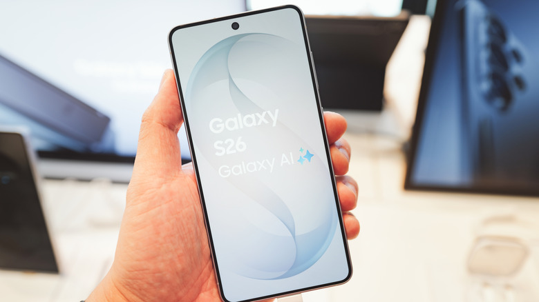 Close-up of a person holding the Galaxy S26 in a store