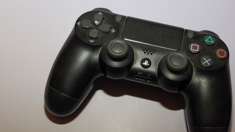 The 1st Generation DualShock 4 on a white surface