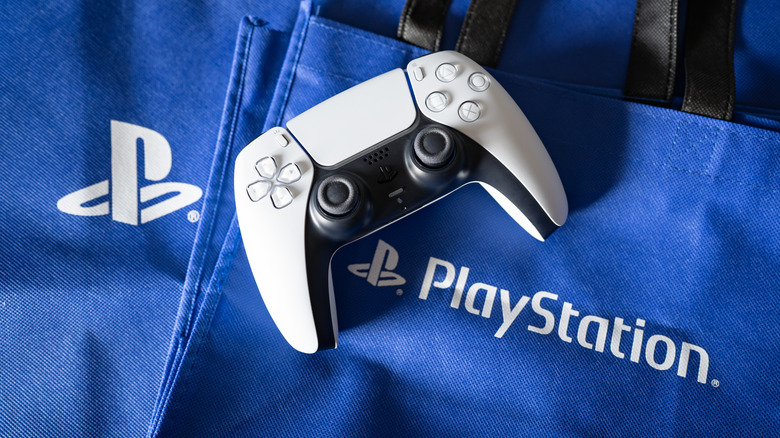 The DualSense controller placed on a bag with the PlayStation logo
