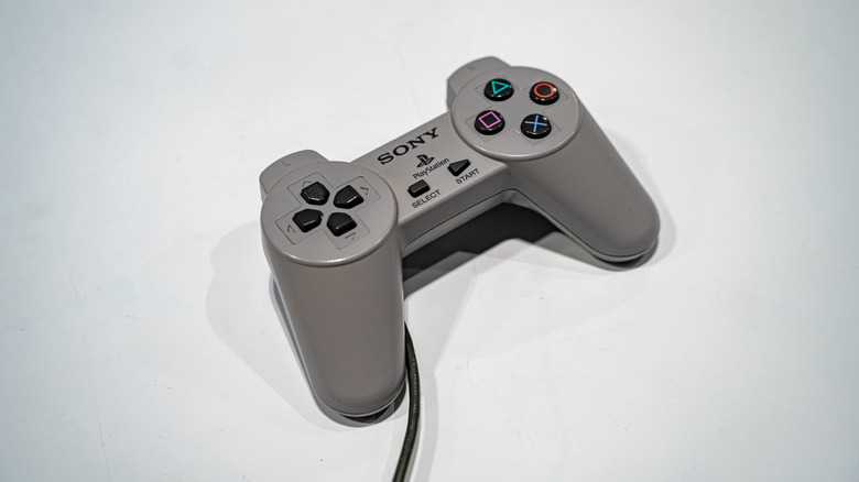 The first ever PlayStation controller on a white surface