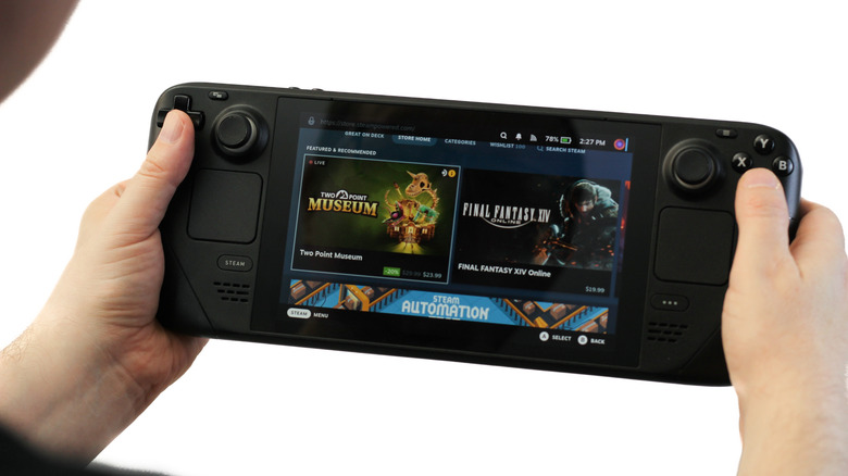 A person using a Steam Deck to browse a gaming library.