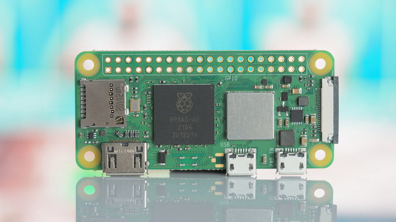 A Raspberry Pi Zero 2 on a glass worktop
