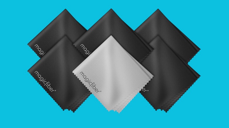 MagicFiber microfiber cleaning cloths in black and gray on a blue background