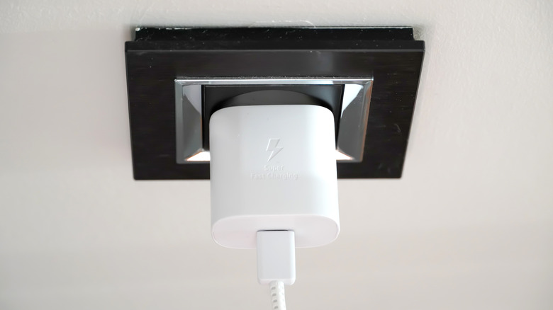 A fast charger connected to a wall outlet
